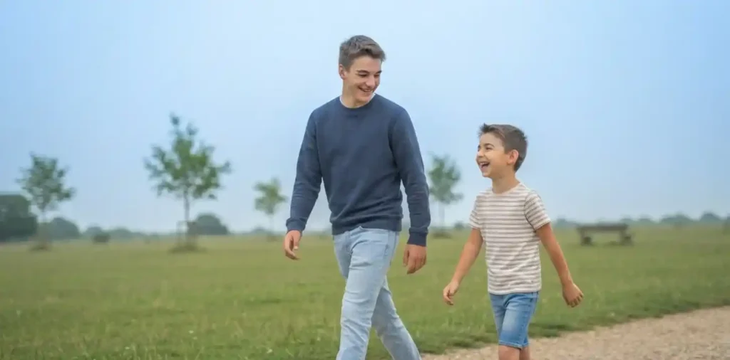 Two brothers laughing together outdoors