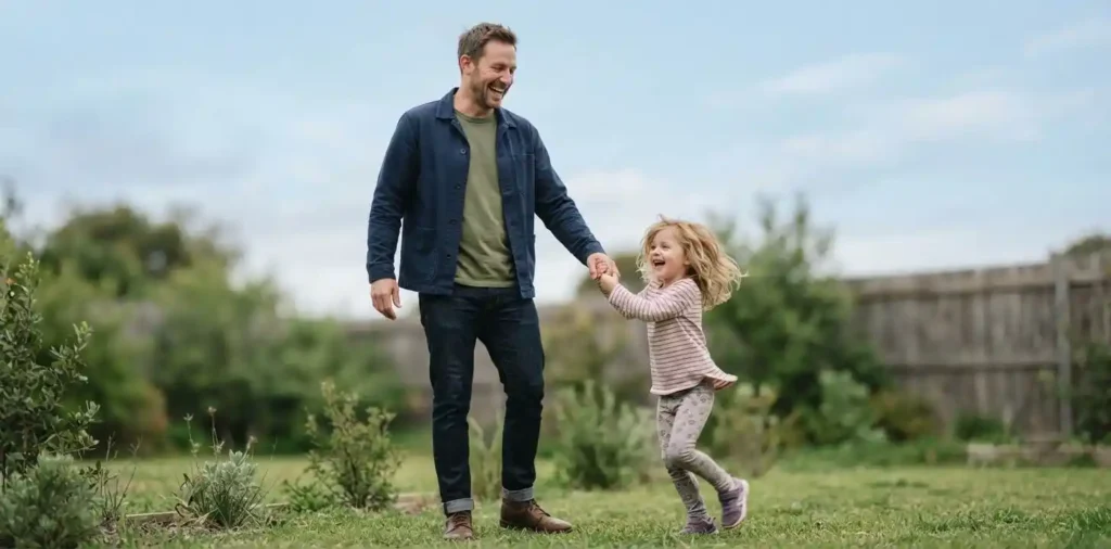 Father and daughter sharing a playful moment
