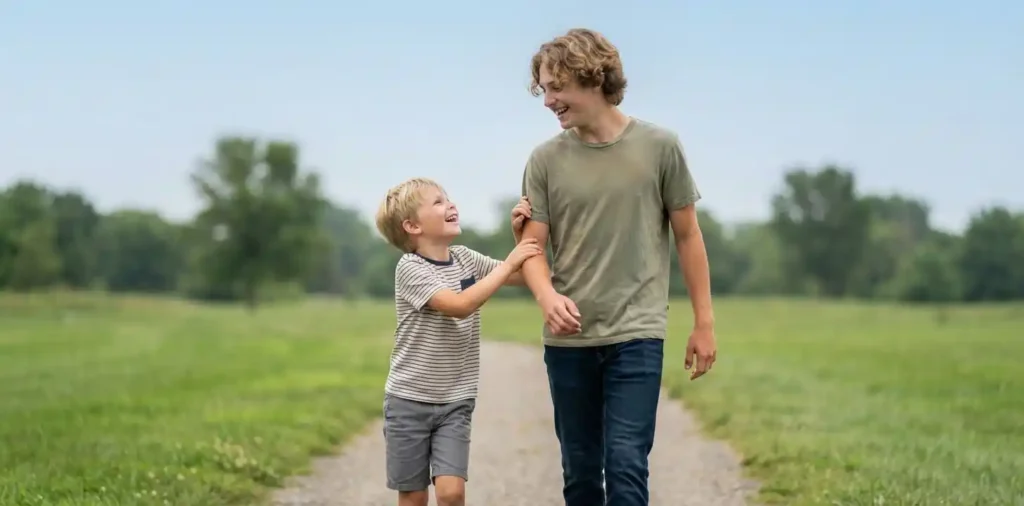 Brothers laughing together during a casual walk